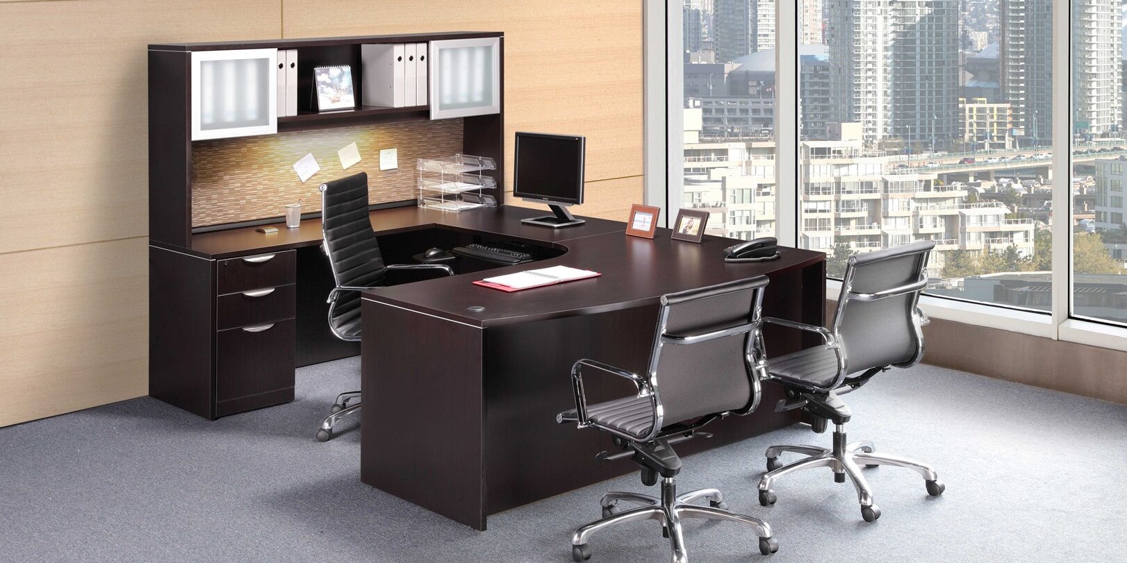 A large office with a desk and chairs