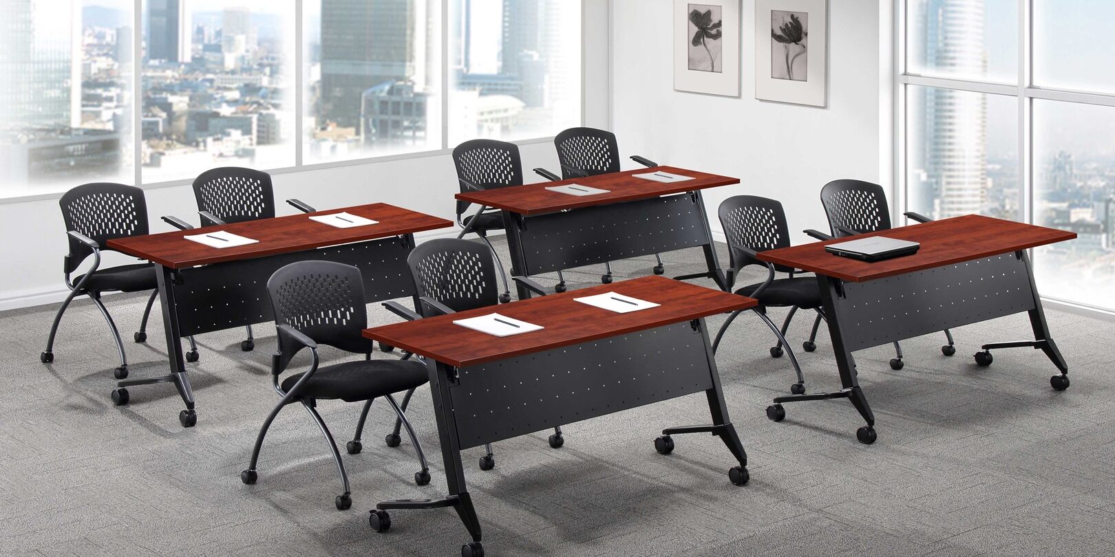 A group of tables and chairs in an office setting.
